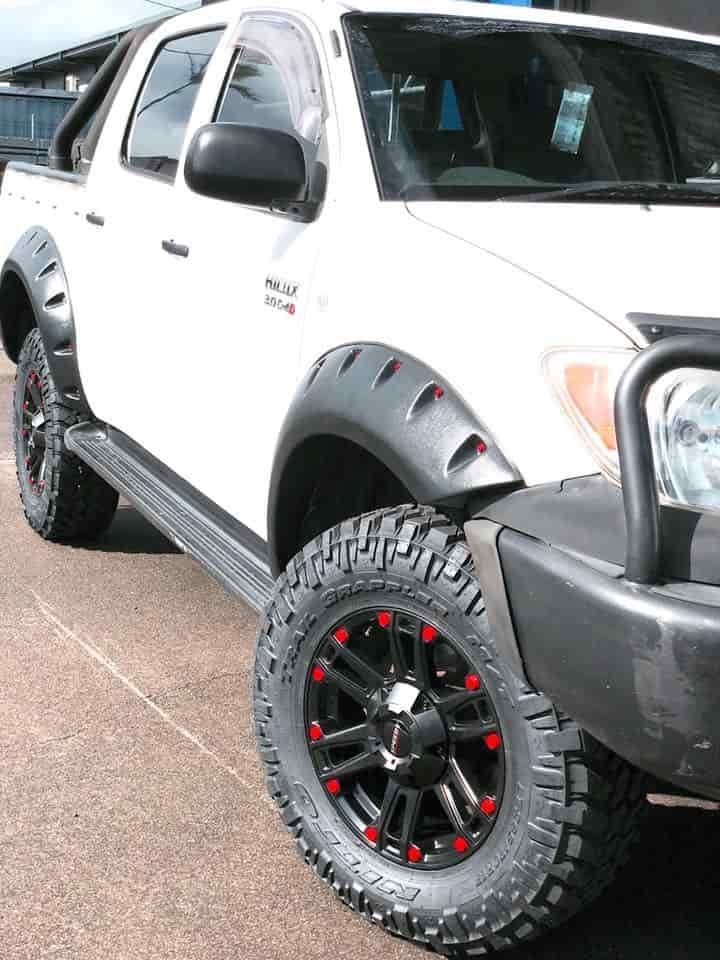 A White Truck with Black Fender Flares and Red Wheels — Torque Tyres & Trailer Spares Cairns in Cairns, QLD