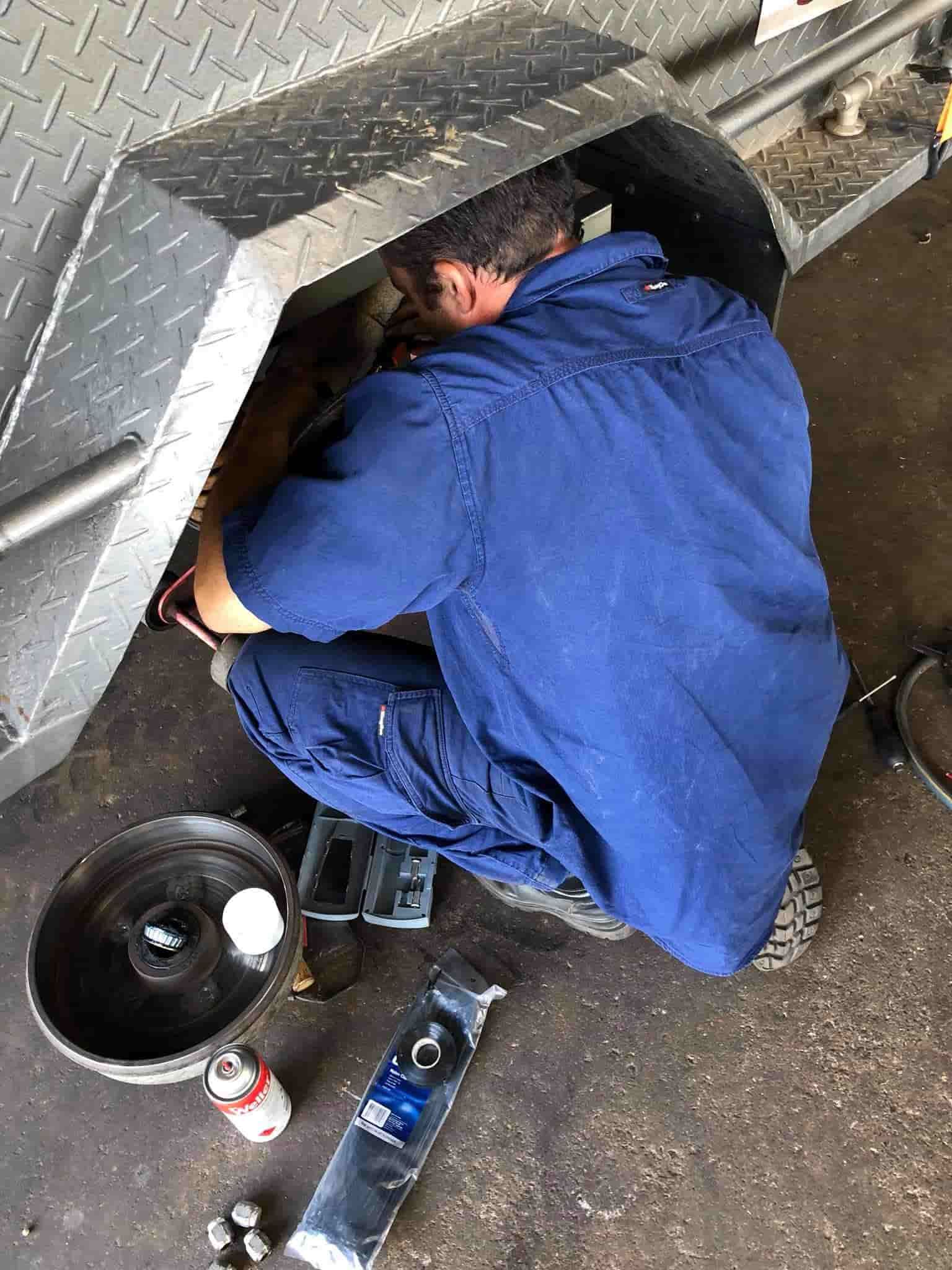 A Mechanic Repairing a Trailer — Torque Tyres & Trailer Spares Cairns in Cairns, QLD