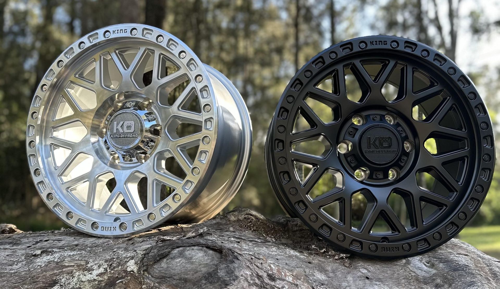 A pair of wheels are sitting on top of a rock.