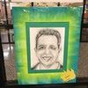 A black and white drawing of a man in a green frame.
