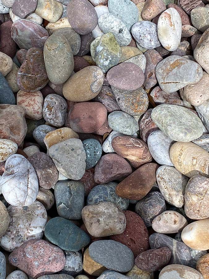 A pile of rocks of different colors and sizes.