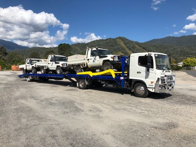 A Tow Truck is Towing Cars on the Highway — Crossborder Towing in South Albury, NSW