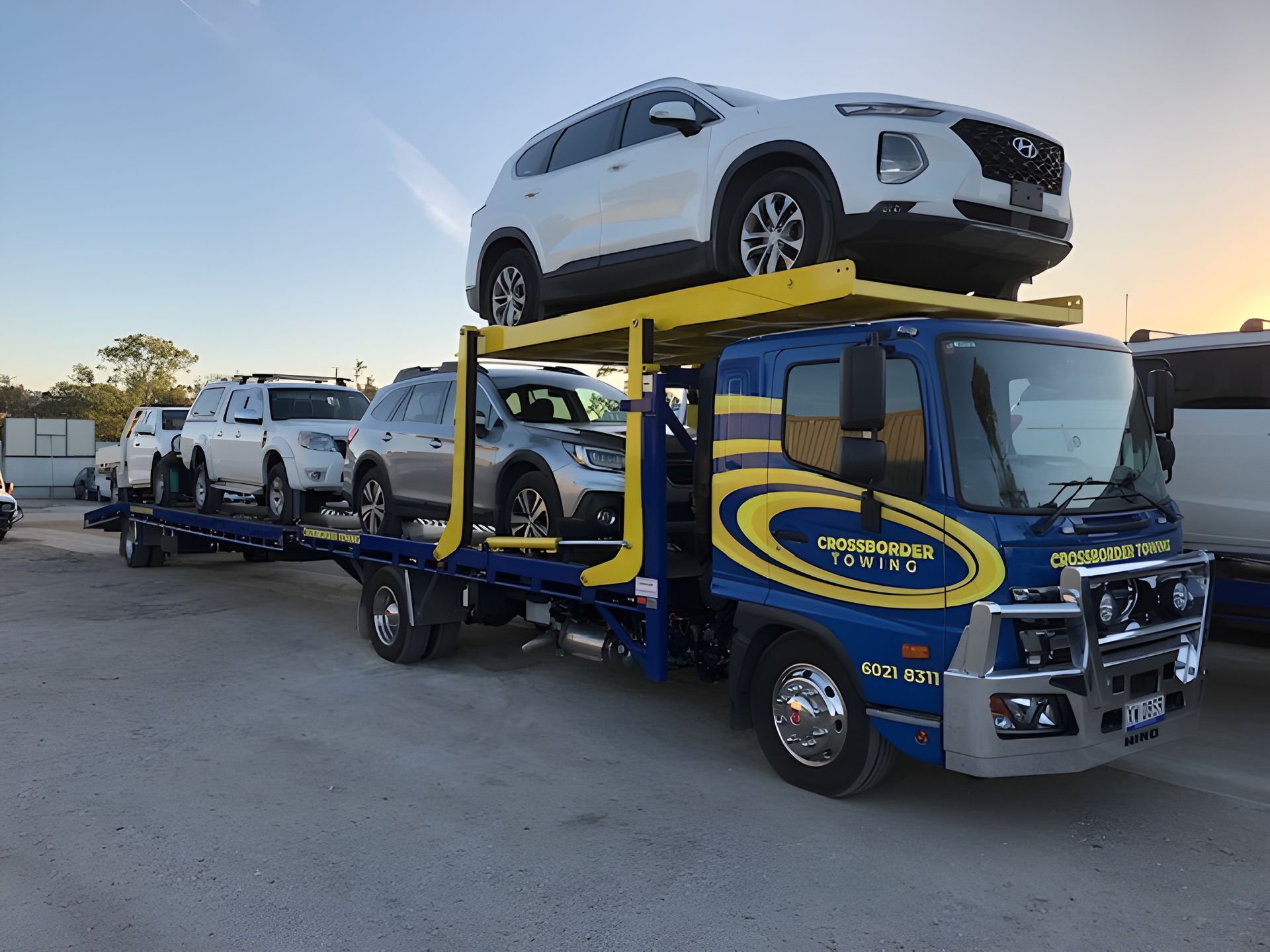 A Car is Being Towed by a Tow Truck on the Side of the Road — Crossborder Towing in South Albury, NSW