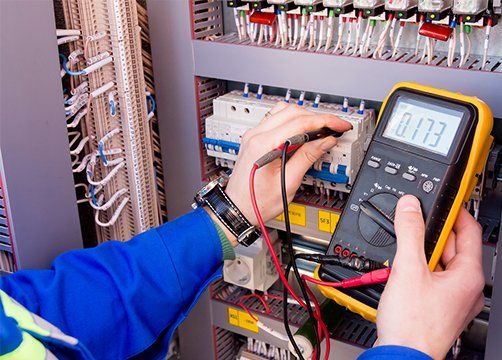 Electrician Measures Voltage by Tester — Bartlett, TN — EnviroUSA