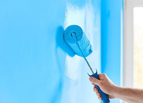Painting Wall With Paint Roller — Bartlett, TN — EnviroUSA