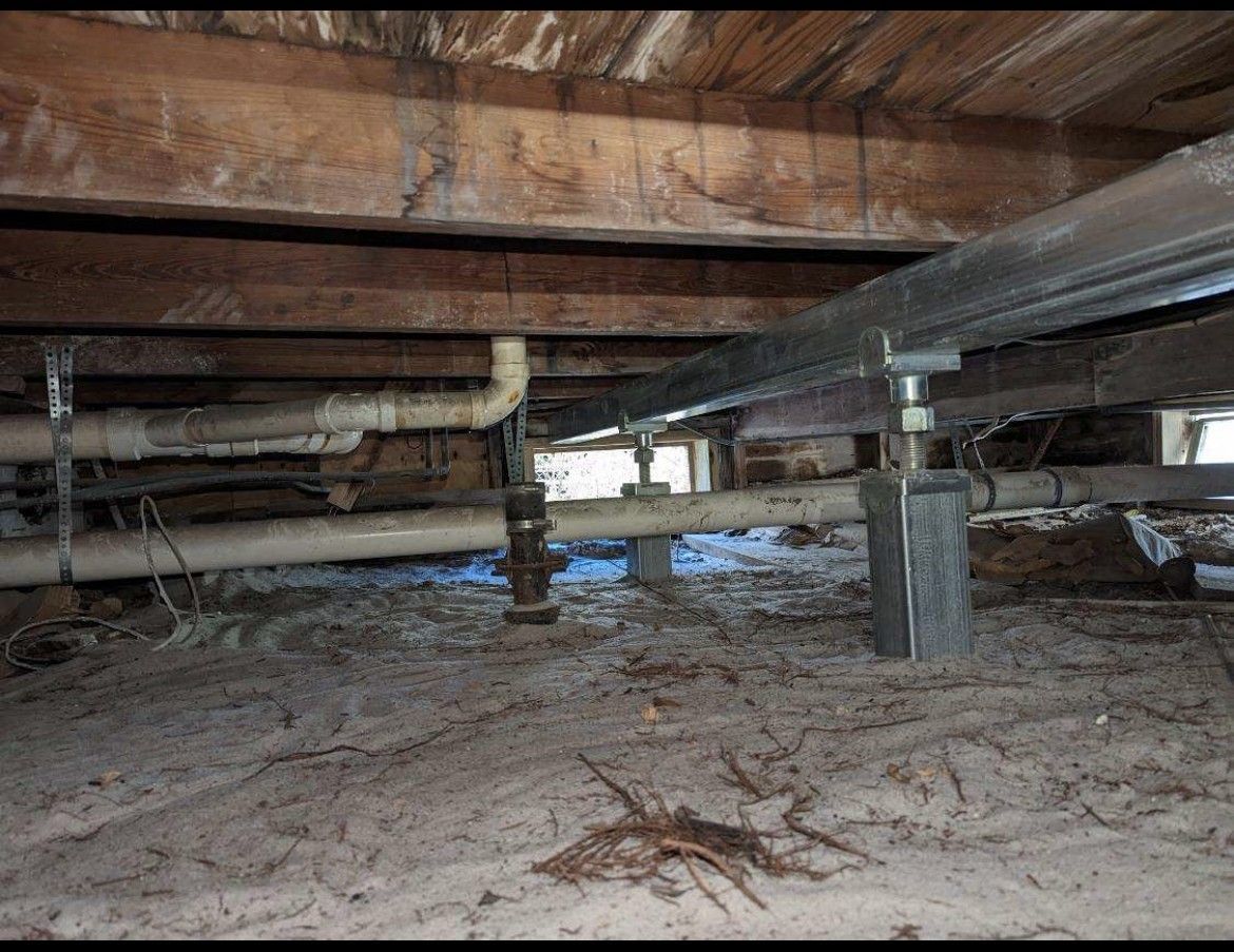 A close up of a metal structure in a basement.