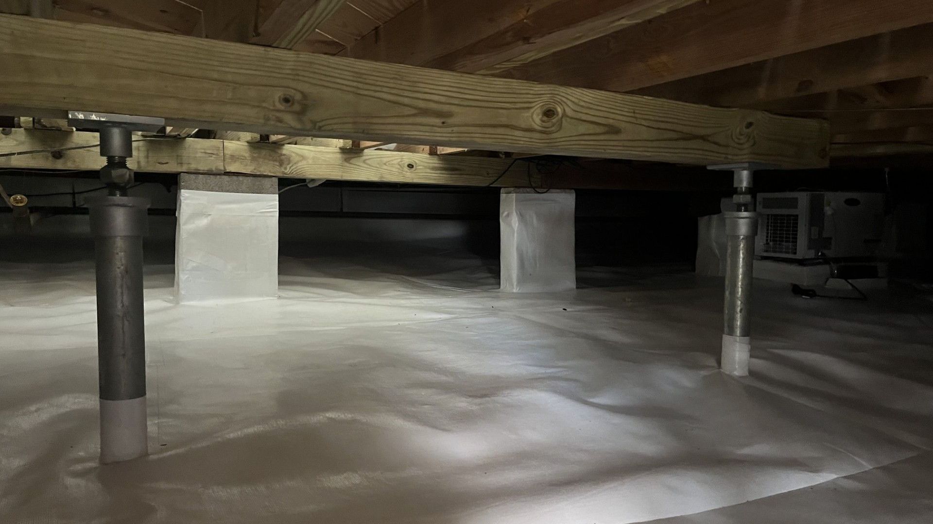 A close up of a metal structure in a basement.