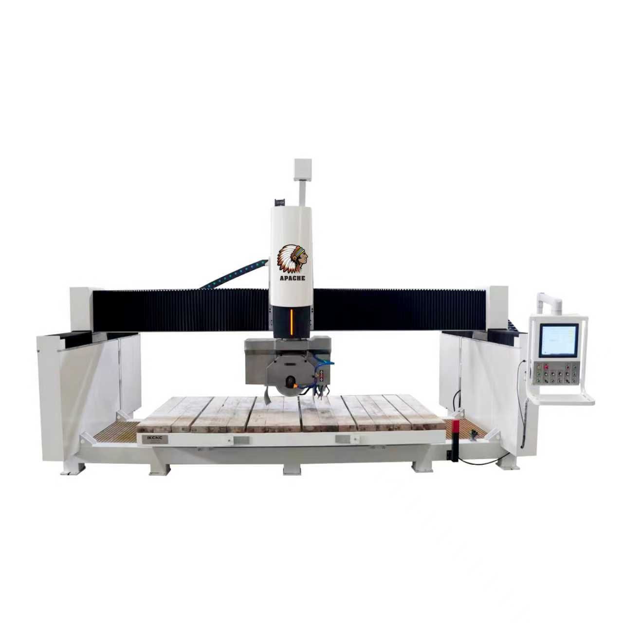 Large white CNC machine cutting stone. Control panel on the right.