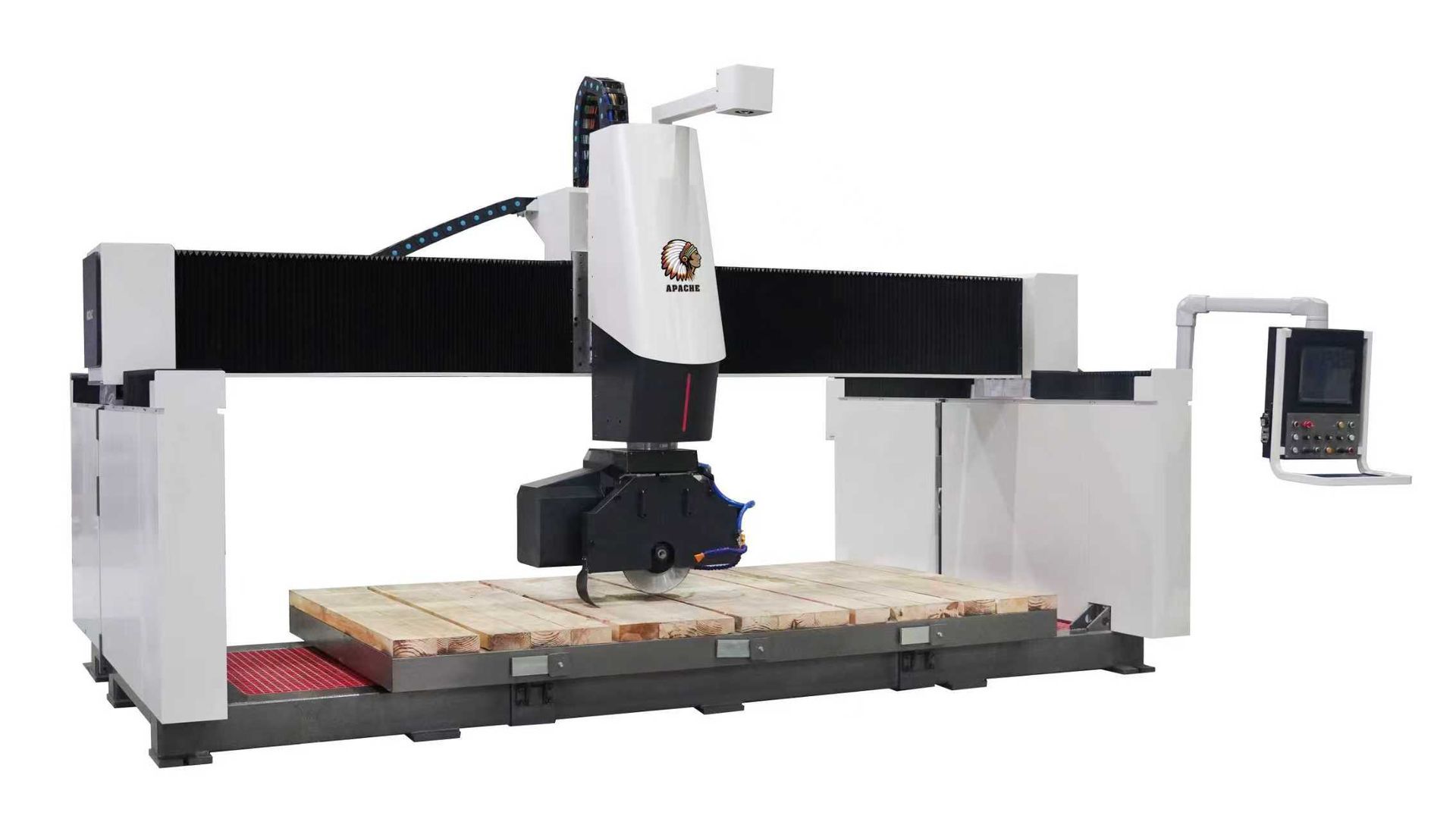 CNC machine, white and black, processing a stone slab. Computer control panel is visible.