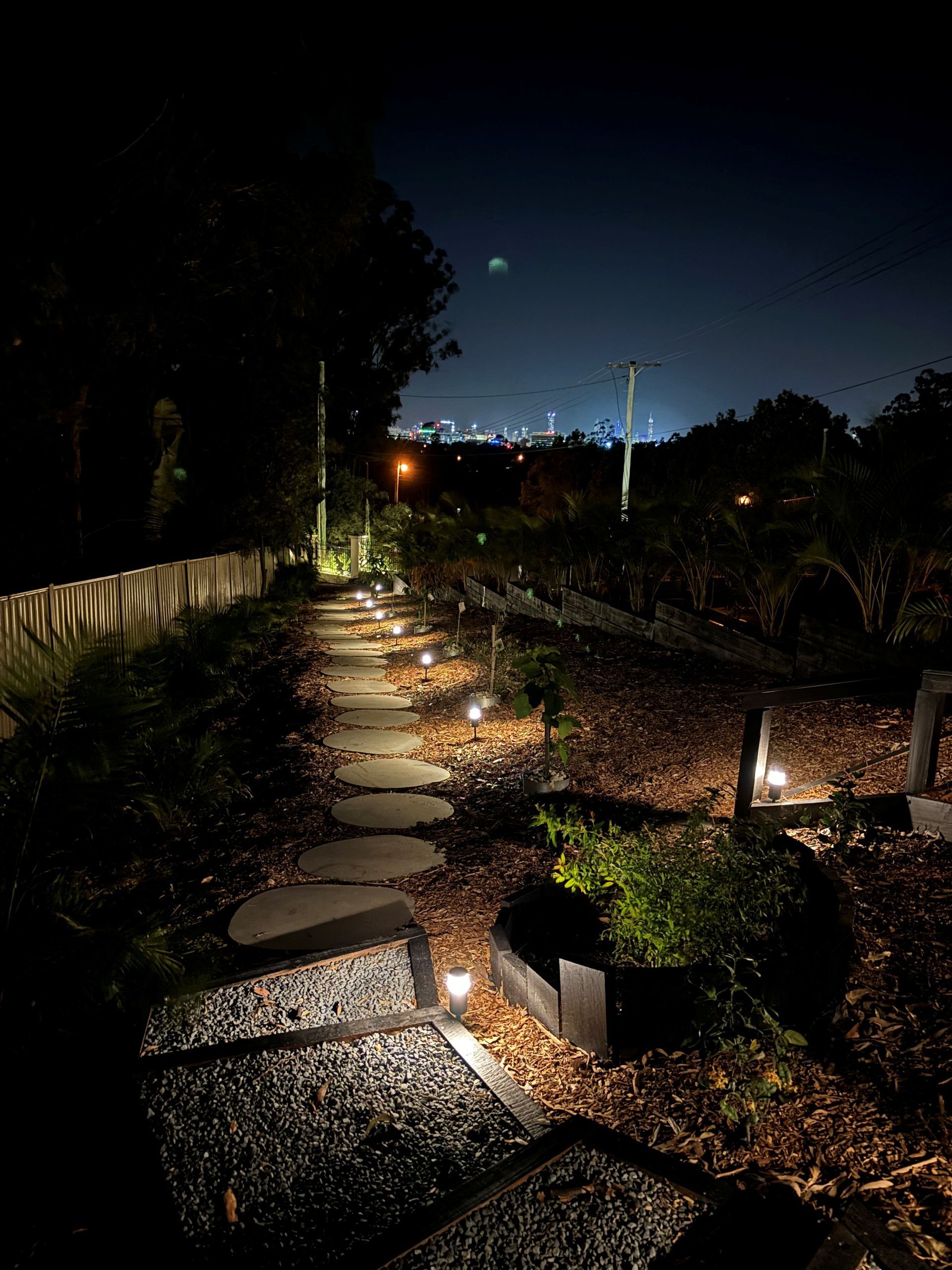 A well lit garden path at night time — Short Stop Electrical in Nerang, QLD