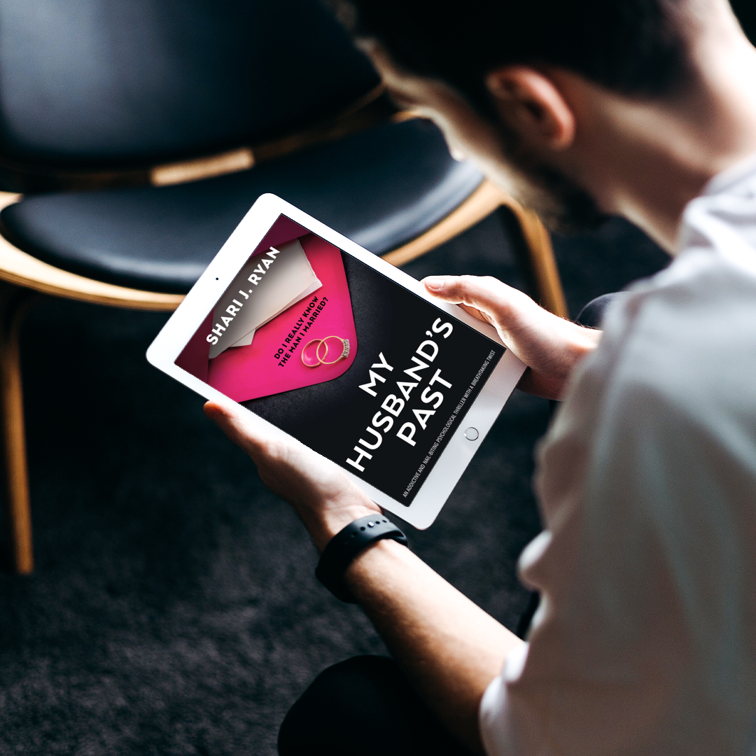 A man is reading my husband 's past on a tablet