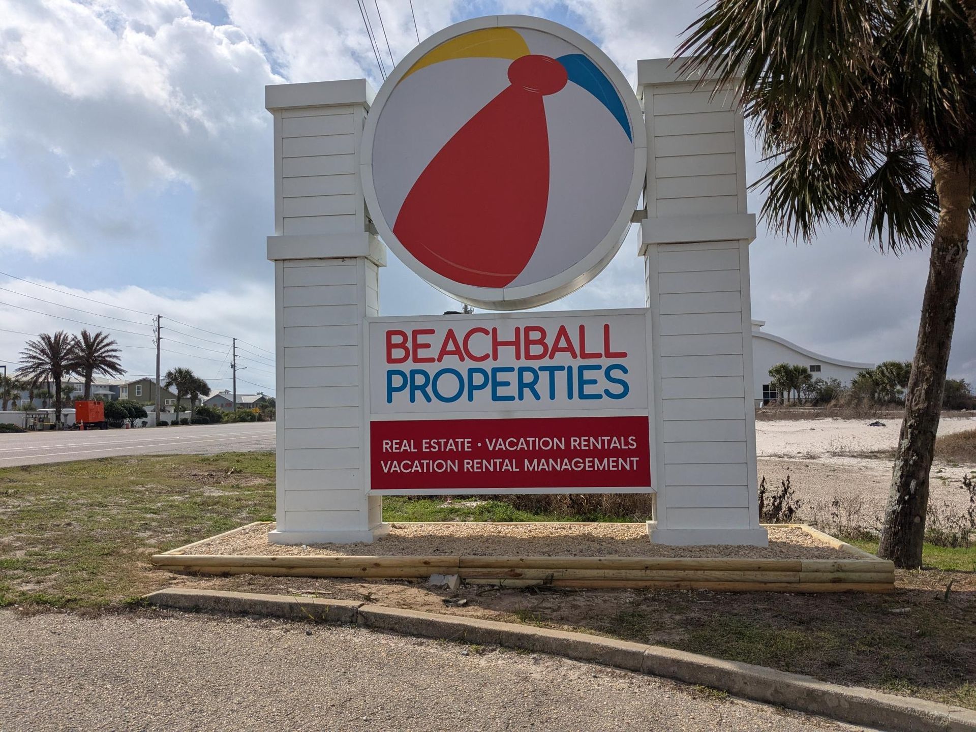 Sign for Beachball Properties: large beach ball logo above text 