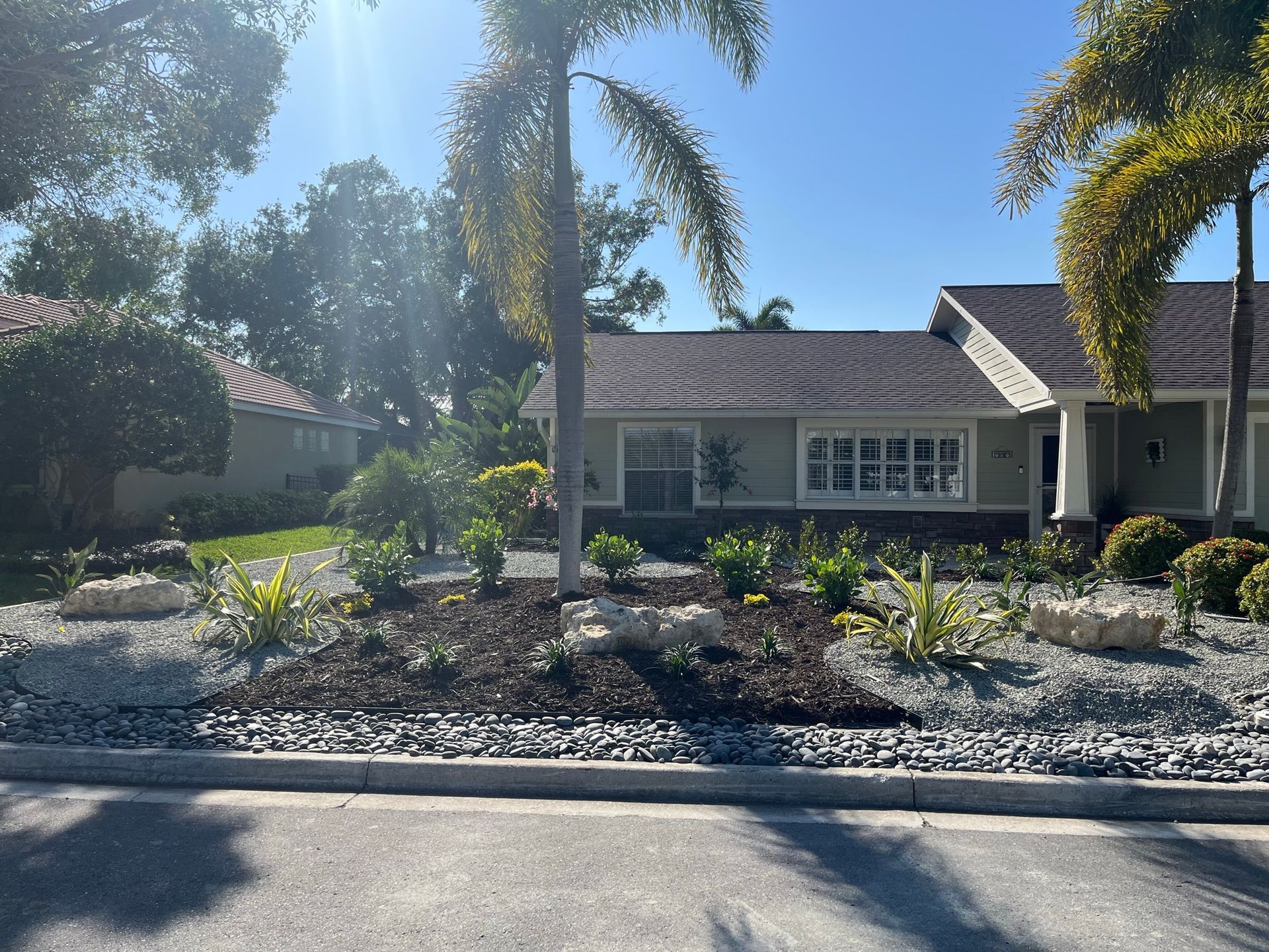 Xeriscape and Florida-friendly landscape design with drought-tolerant plantings at a Sarasota County home