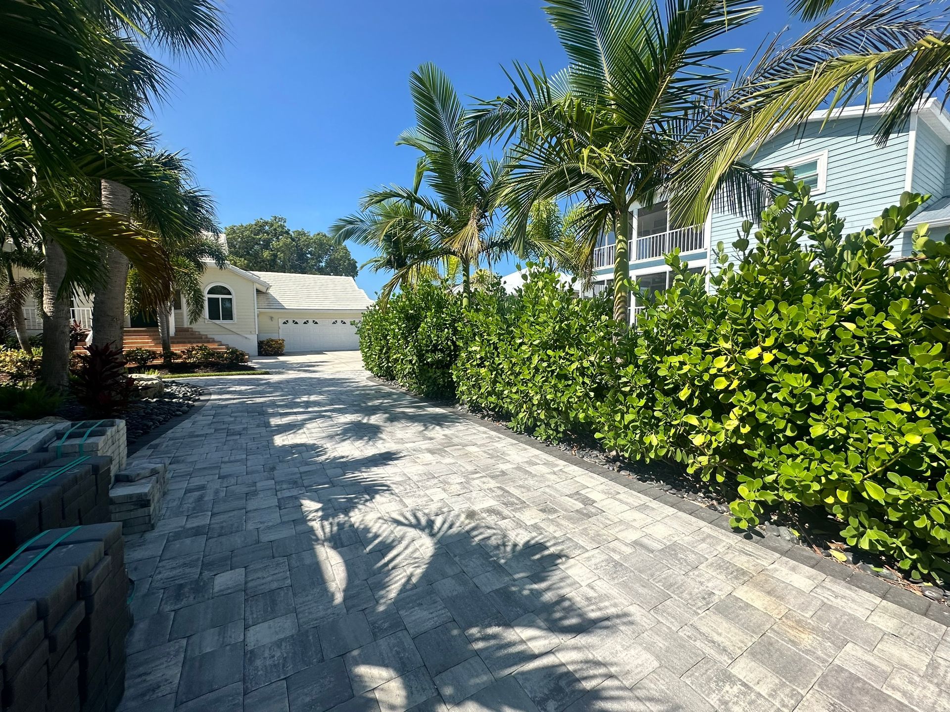 Tropical landscape design with integrated lighting at a Nokomis residence 
