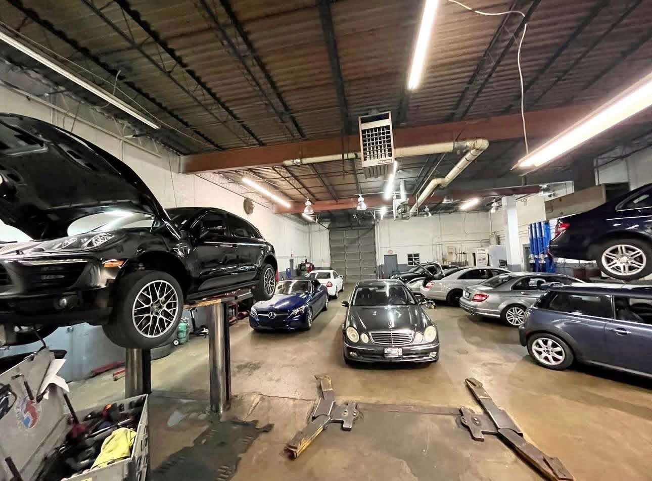 Vehicles inside of our auto repair shop | Benz Elite Automotive