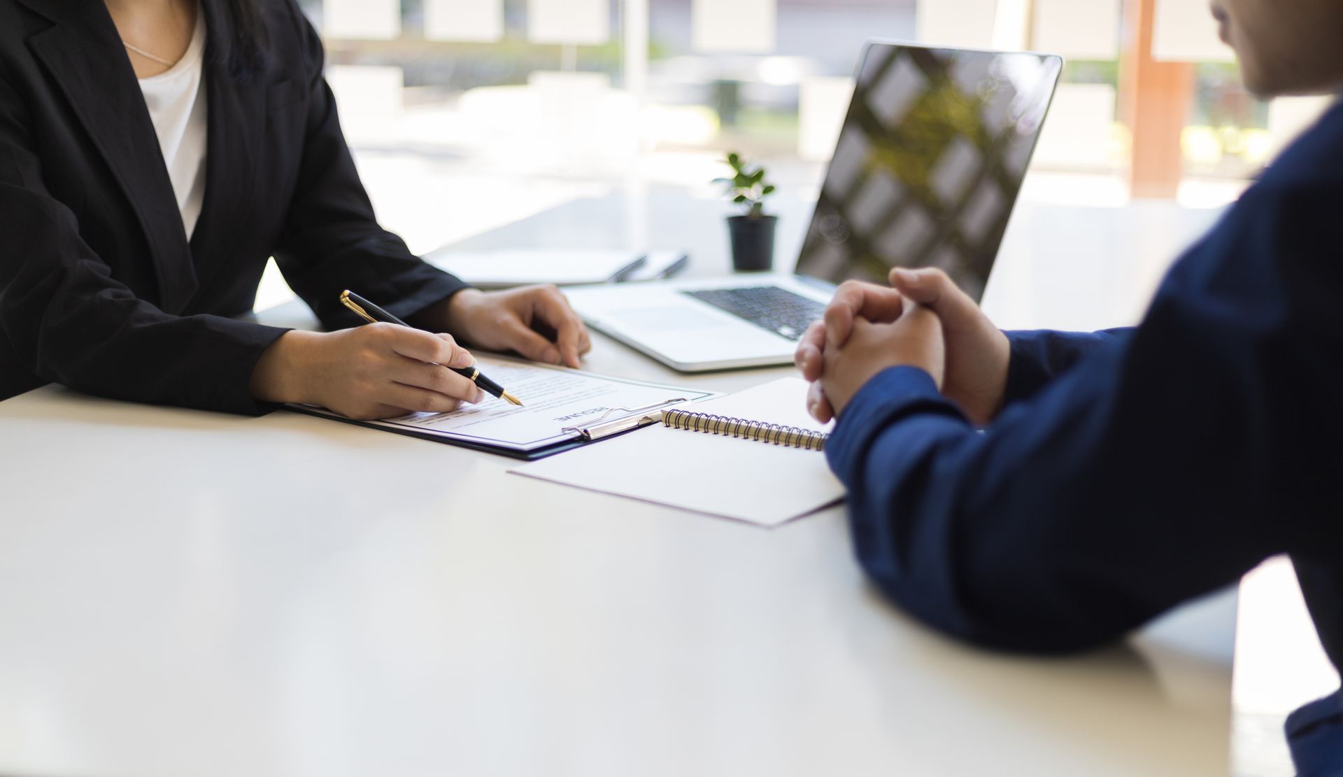 A Man and a Woman Are Sitting at a Table Having a Job Interview