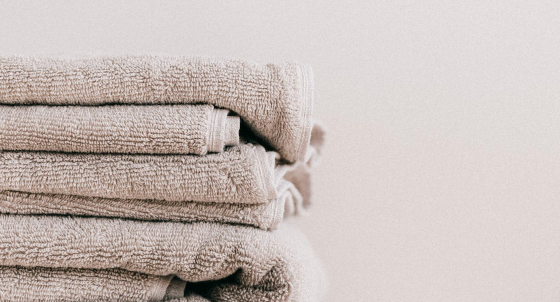 A stack of towels sitting on top of each other on a table.