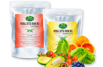 Two bags of herbal detox drink mix surrounded by fruits and vegetables.