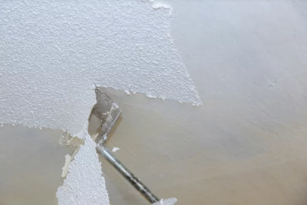 A close up of a piece of ice with a spoon sticking out of it.