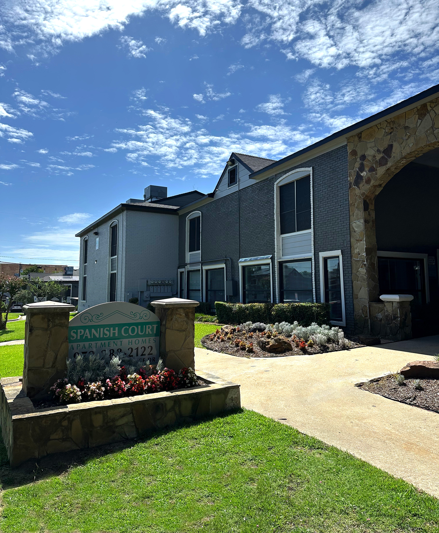 Apartment complex with a sign reading 