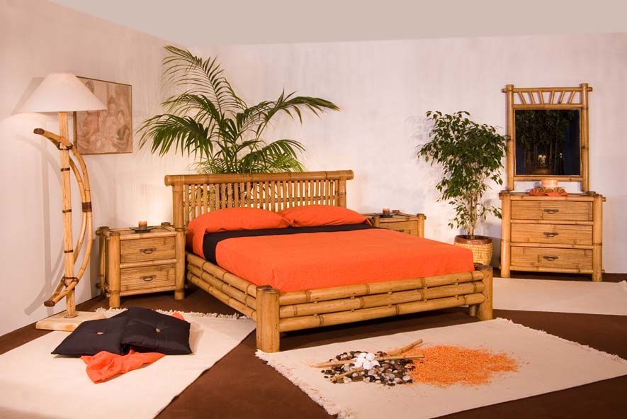 Una camera da letto con un letto e una cassettiera in bambù
