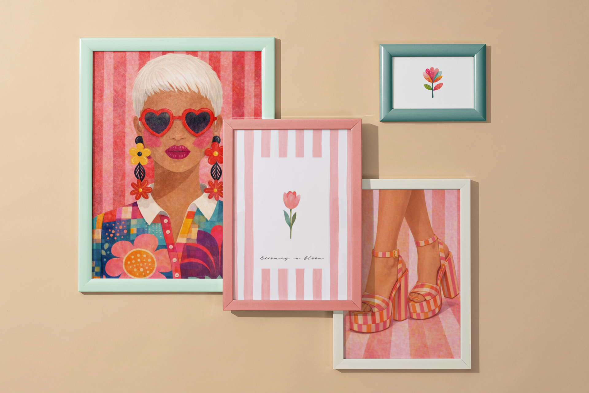 Four pastel-framed fashion and floral prints on a beige wall