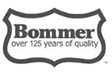 Bommer brand logo: dark gray shield-shaped emblem with the company name and tagline 