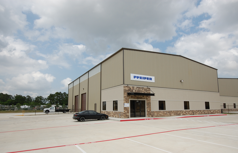 A car is parked in front of a building that says pfpower