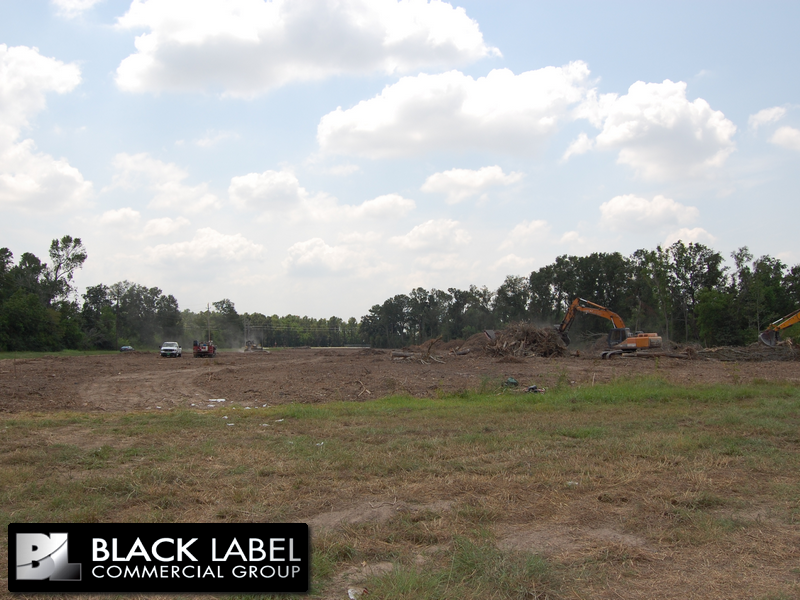 A black label commercial group logo is on a field