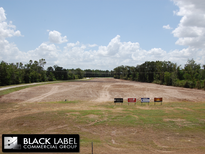 A field with a black label commercial group logo on it