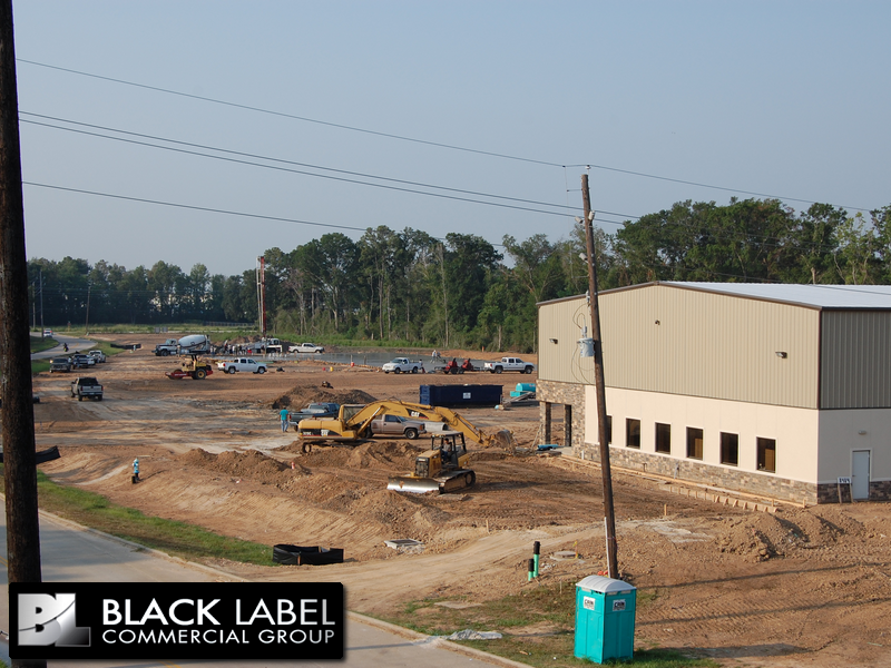 A construction site with a sign that says black label commercial group