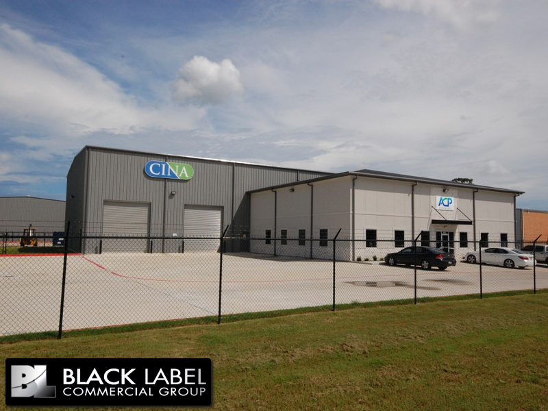 A large gray building with the word cina on it