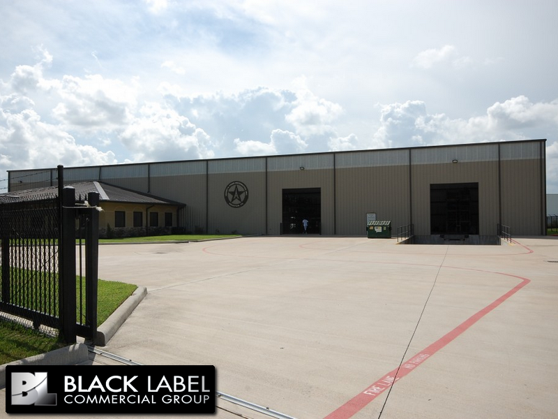 A large building with a sign that says black label commercial group