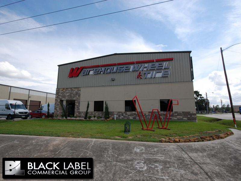 A large building with warehouse wheel and tire written on it