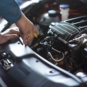 Mechanic Checking Engine - Auto Maintenance in Carmi, IL