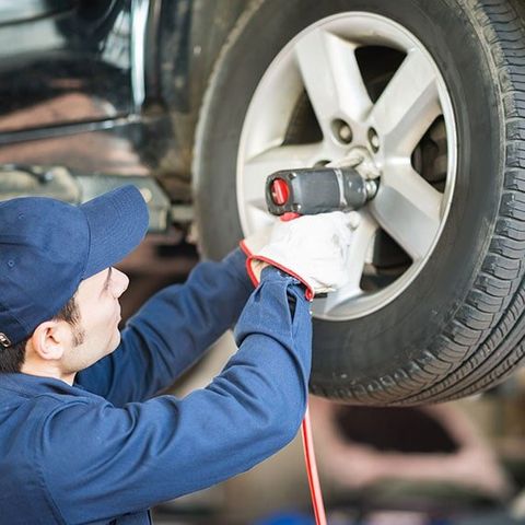 Mechanic Installing New Tires - Auto Repair in Carmi, IL