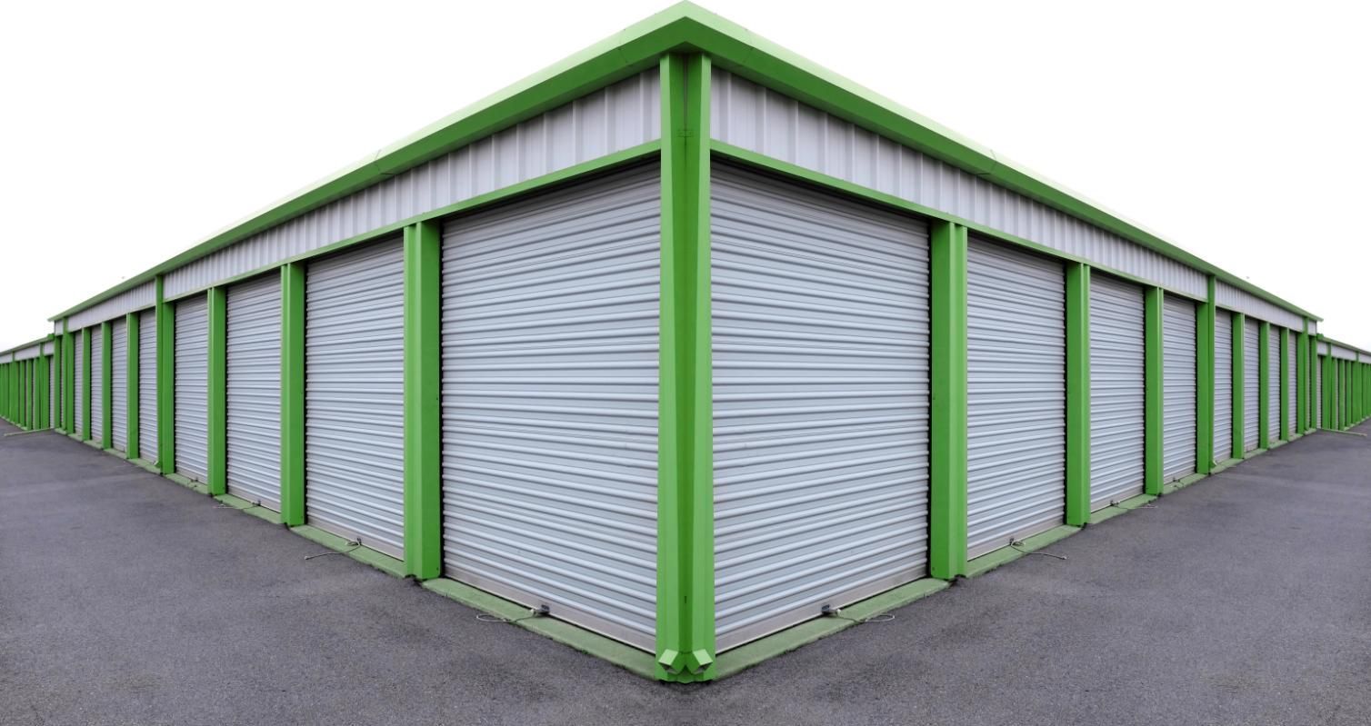 Row of Green and White Storage Units With Roller Doors — Bargara Removals in Woodgate, QLD