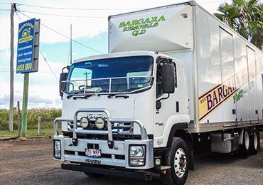 White Truck is Parked in Front of a Gas Station — Bargara Removals in Rubyanna, QLD