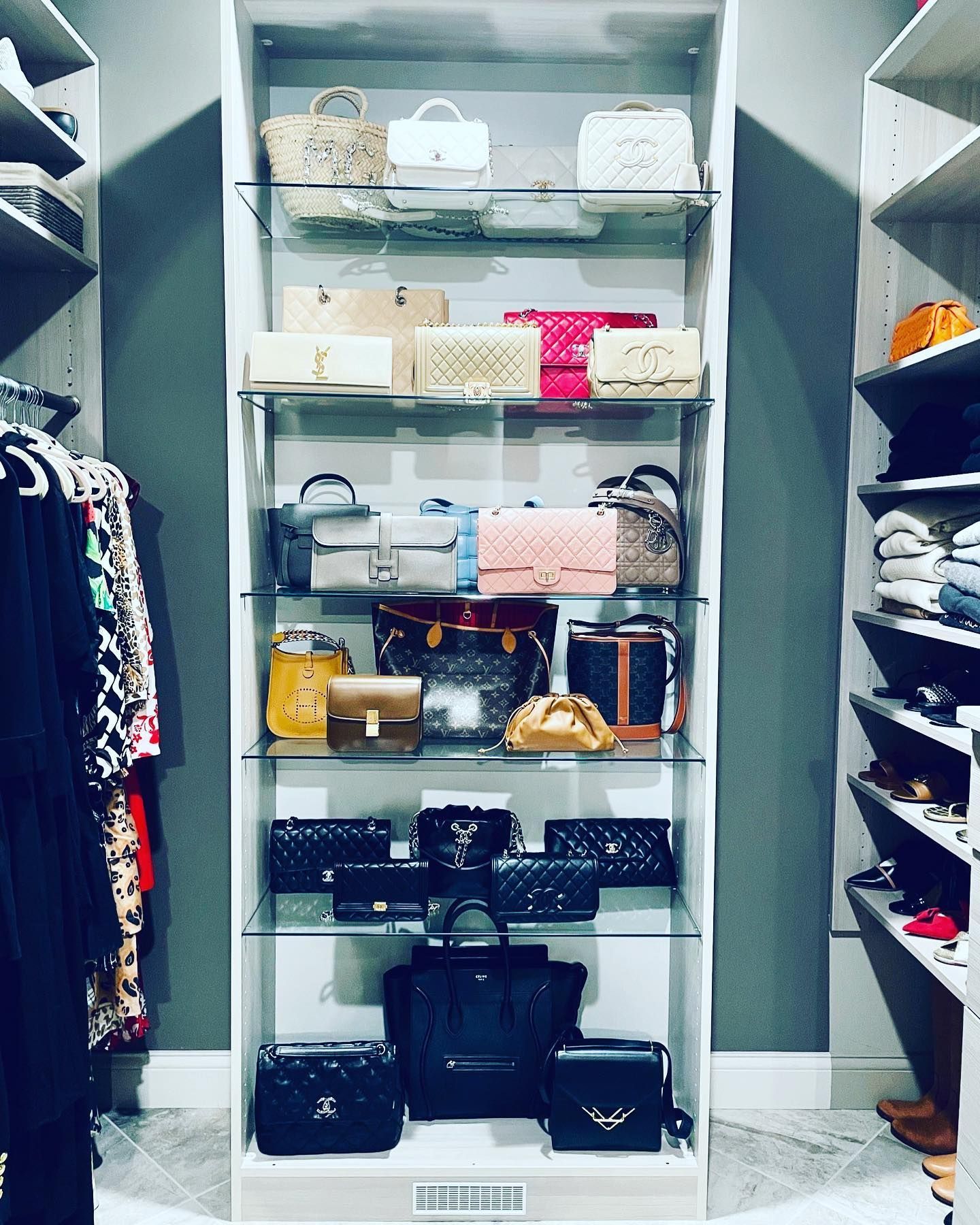 a closet filled with lots of bags including chanel