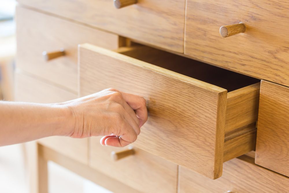 Opening wooden drawer by hand