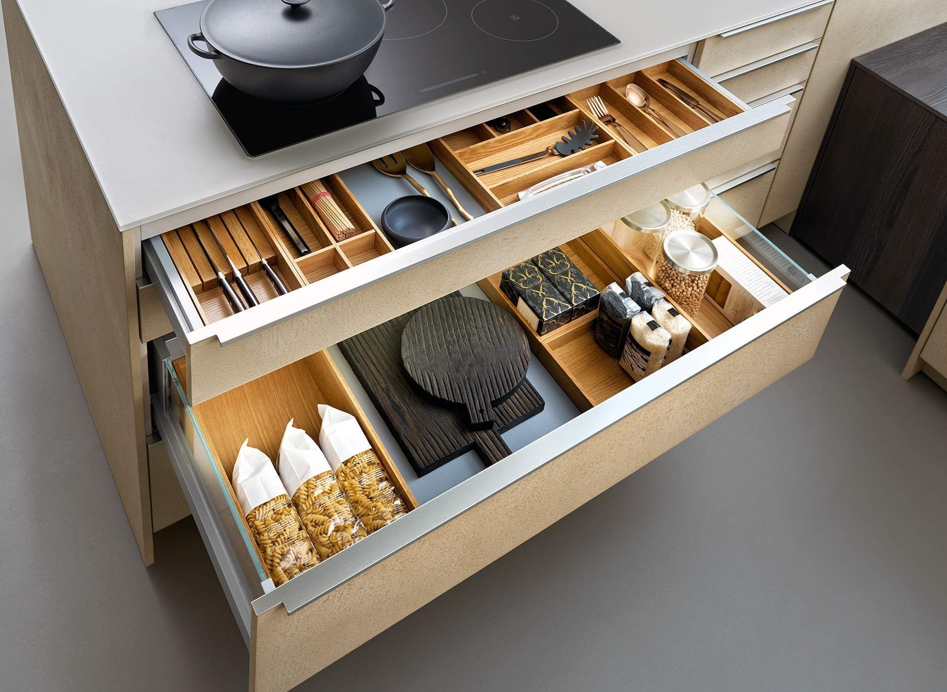 a kitchen drawer filled with utensils and pasta