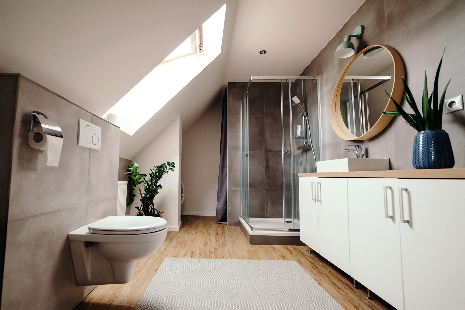 A bathroom with a toilet , sink , and shower.