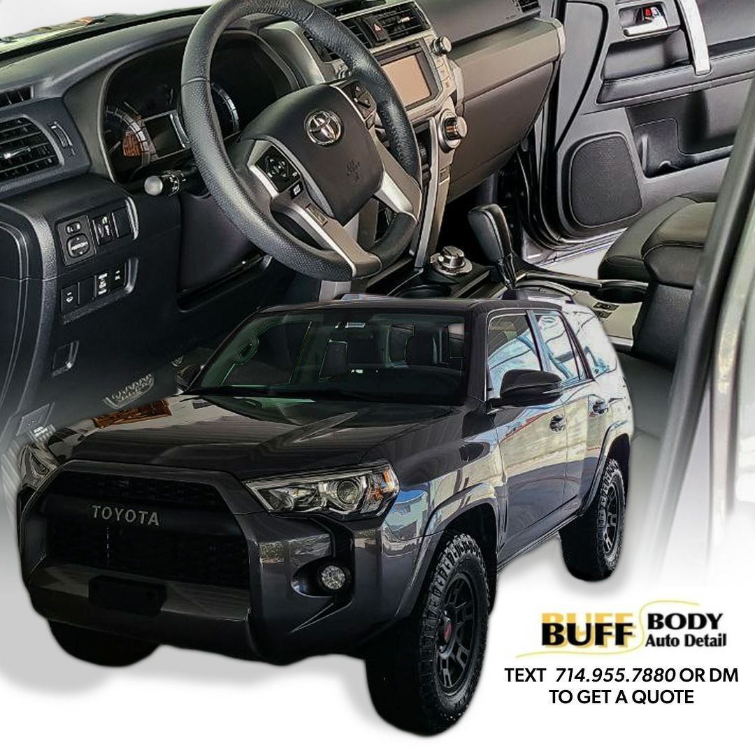 A black toyota suv is sitting on a white surface