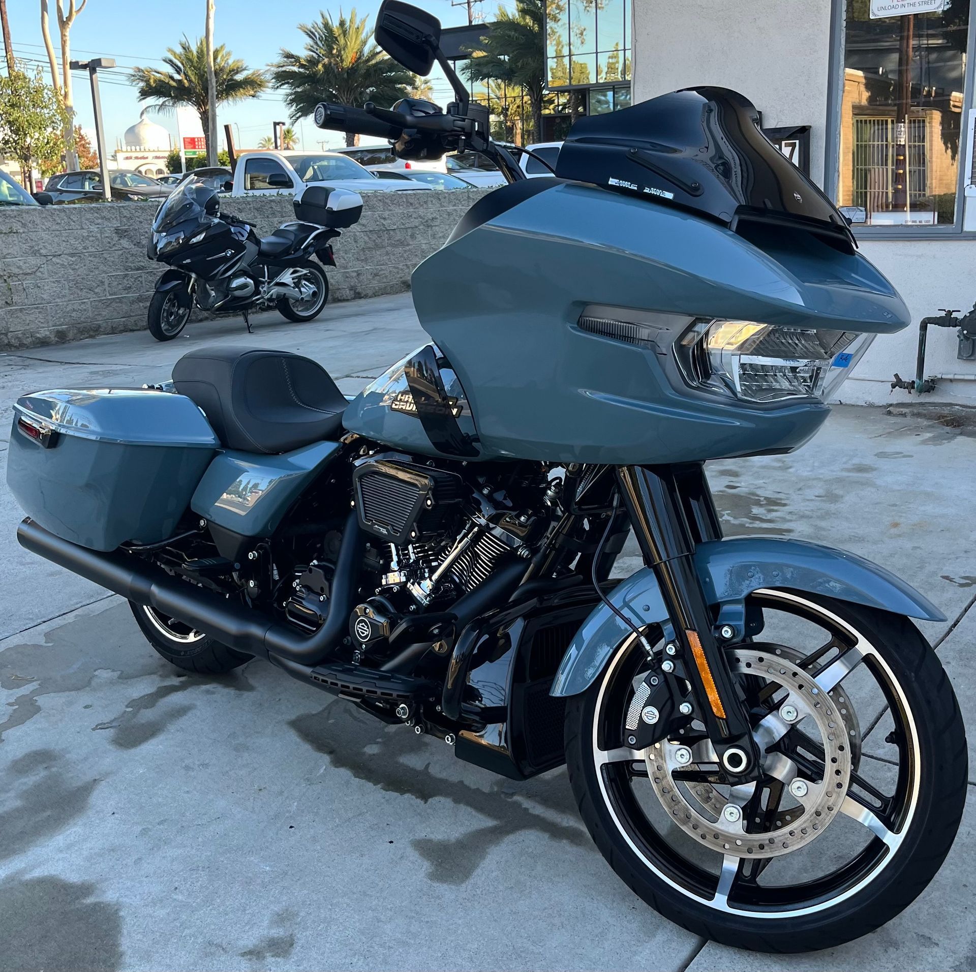 A harley davidson motorcycle is parked in front of a building