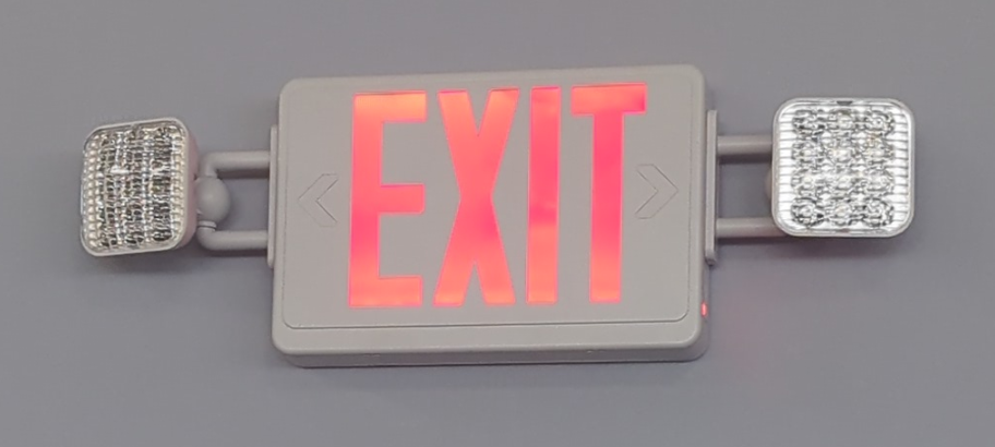 A red exit sign is hanging on a wall.