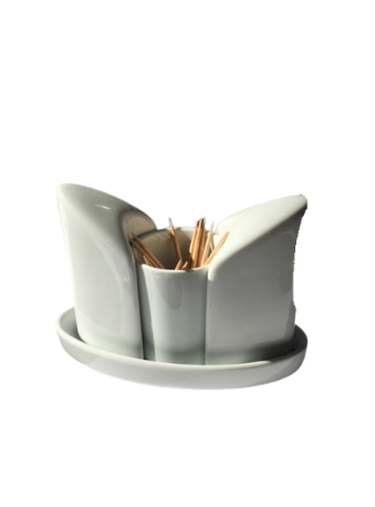 Porte-cure-dents en céramique blanche avec cure-dents sur une soucoupe assortie