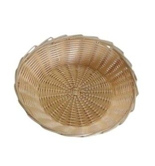 Panier rond en osier tressé avec un intérieur peu profond et beige