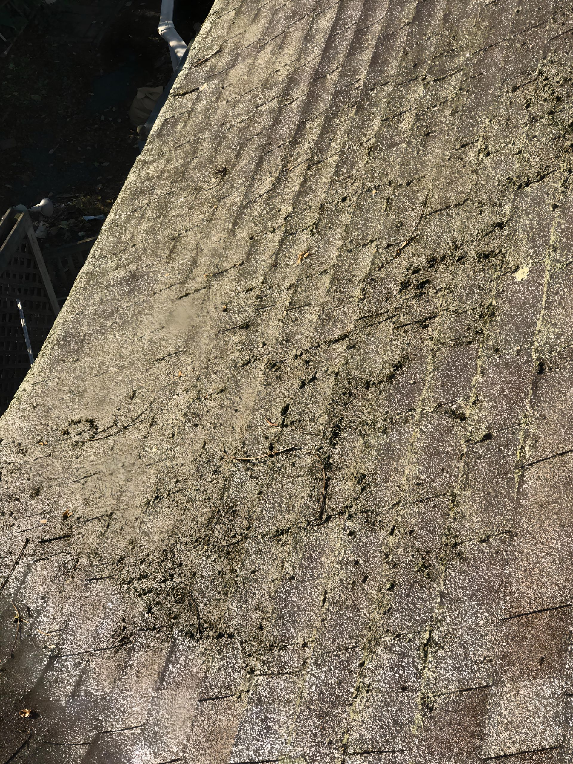 A close up of a dirty roof with a lot of dust on it