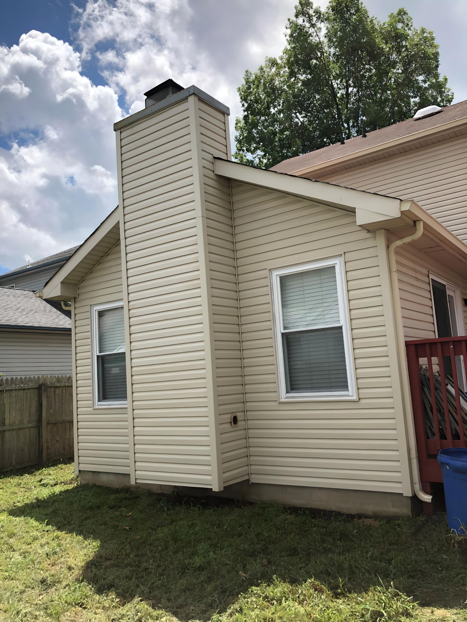 A house with a chimney on the side of it that has just been pressure washed in linwood, nj by Melo Powerwashing & Painting