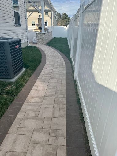 Brick walkway with brown borders installed by melo powerwashing & painting in mays landing, nj